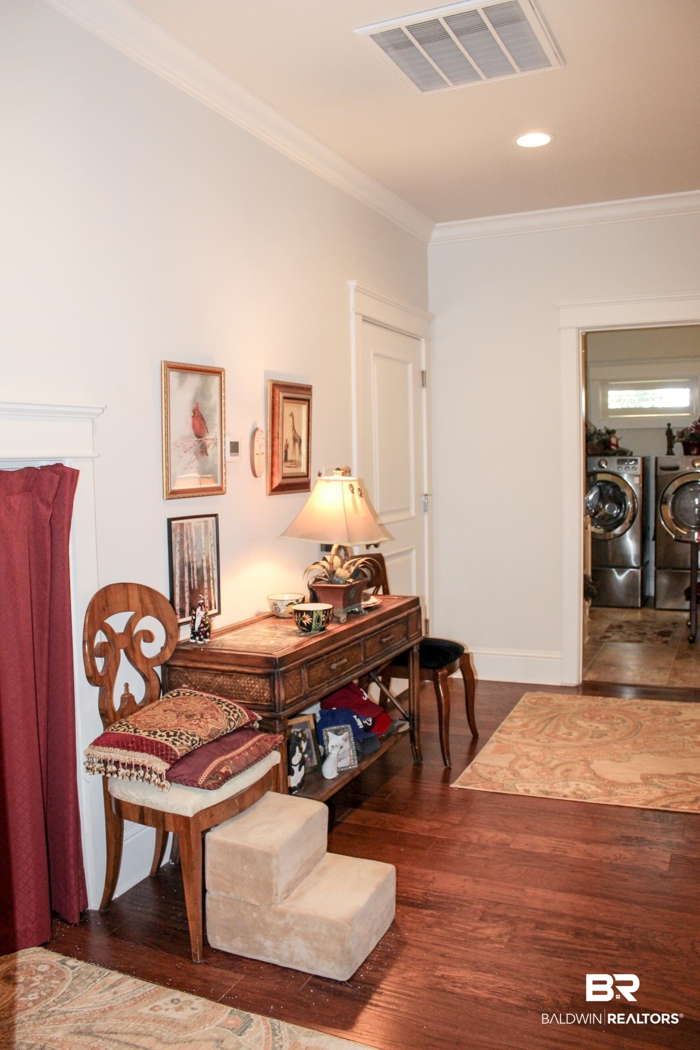 375 Barndling Street Fairhope, AL 36532 - Photo 12 of 24 Sitting room with washer and dryer, dark hardwood / wood-style flooring, and crown molding