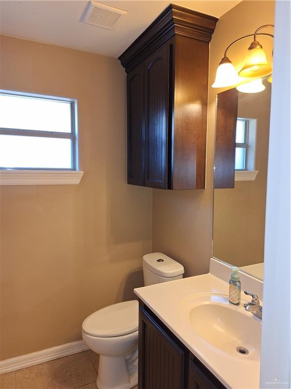 2212 North Ruby Street Edinburg, TX 78541 - Photo 7 of 11 Half bath with vanity and light tile patterned floors
