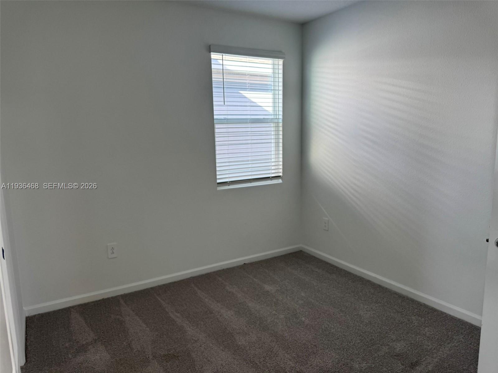 2517 Spring Tune Alley Kissimmee, FL 34744 - Photo 13 of 16 an empty room with a window