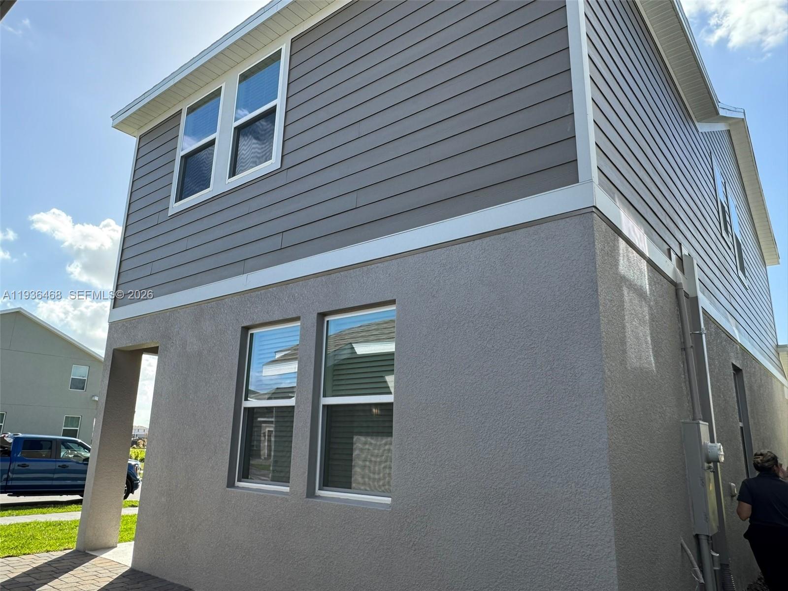 2517 Spring Tune Alley Kissimmee, FL 34744 - Photo 15 of 16 a front view of a house with outdoor seating