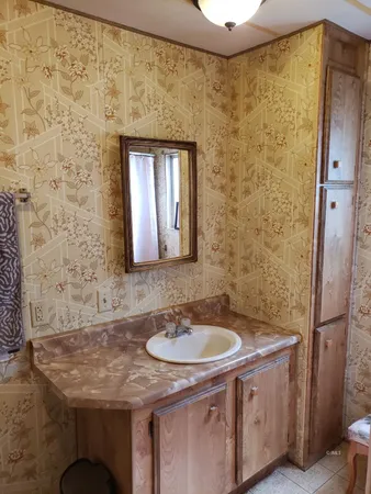 a white toilet sitting next to a shower