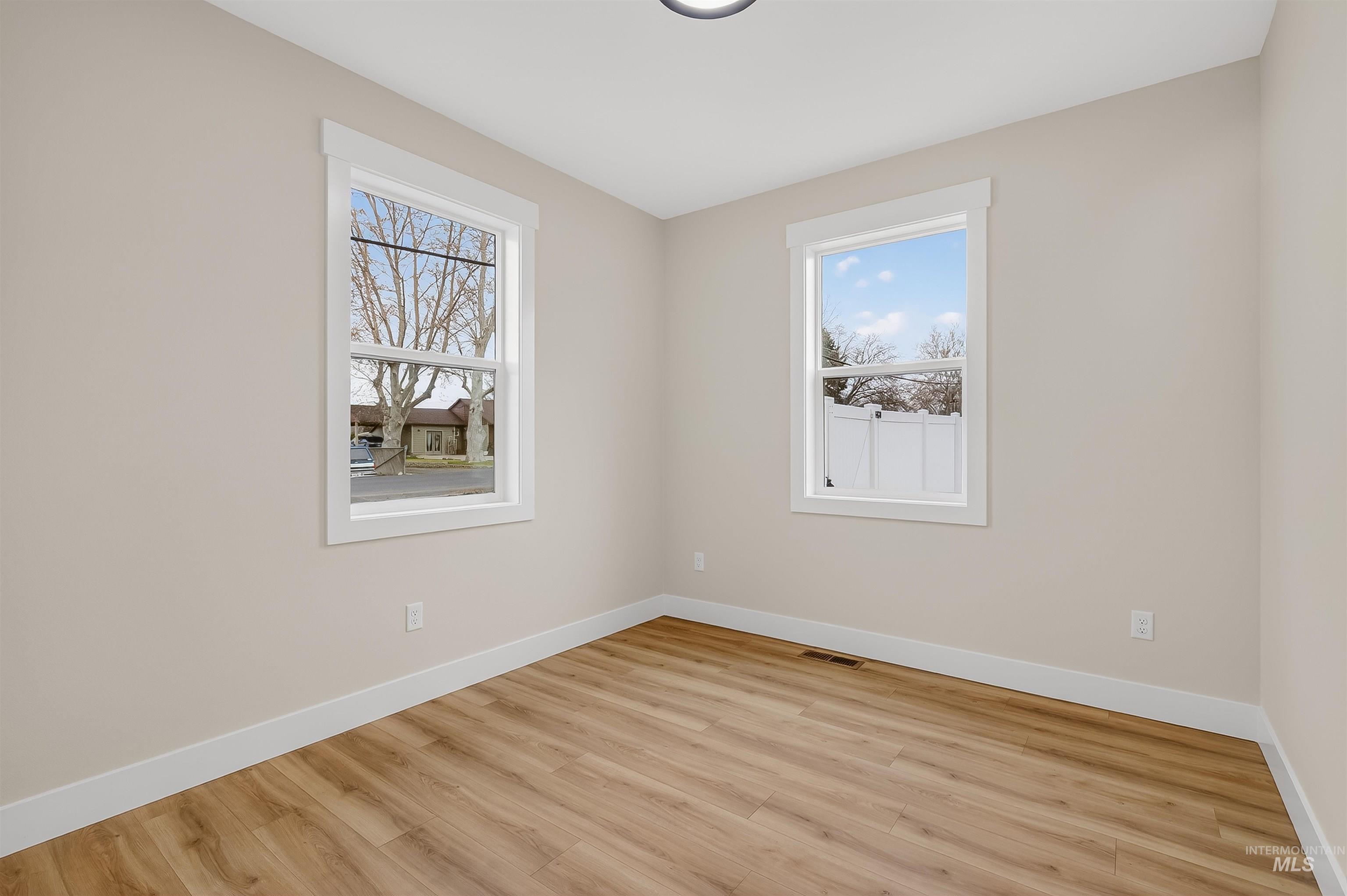 606 Warner Avenue, Unit B Lewiston, ID 83501 - Photo 26 of 38 Spare room with light wood-style flooring and baseboards