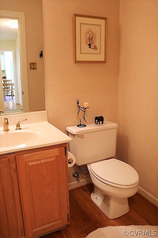 13819 Sandy Oak Road Chester, VA 23831 - Photo 18 of 35 a bathroom with a toilet sink and mirror