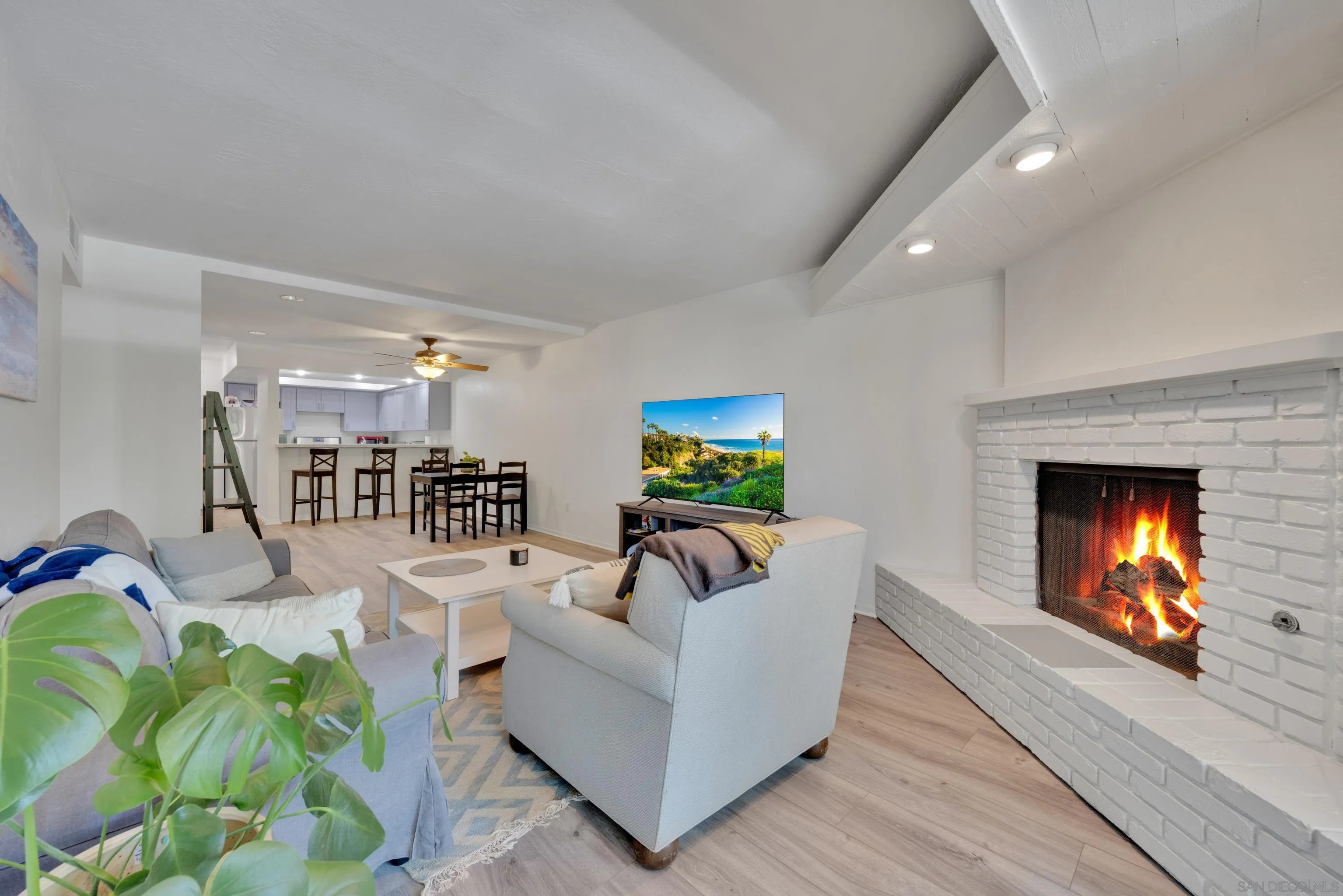 4055 Falcon Street, Unit 102 San Diego, CA 92103 - Photo 1 of 36 a living room with furniture and a fireplace