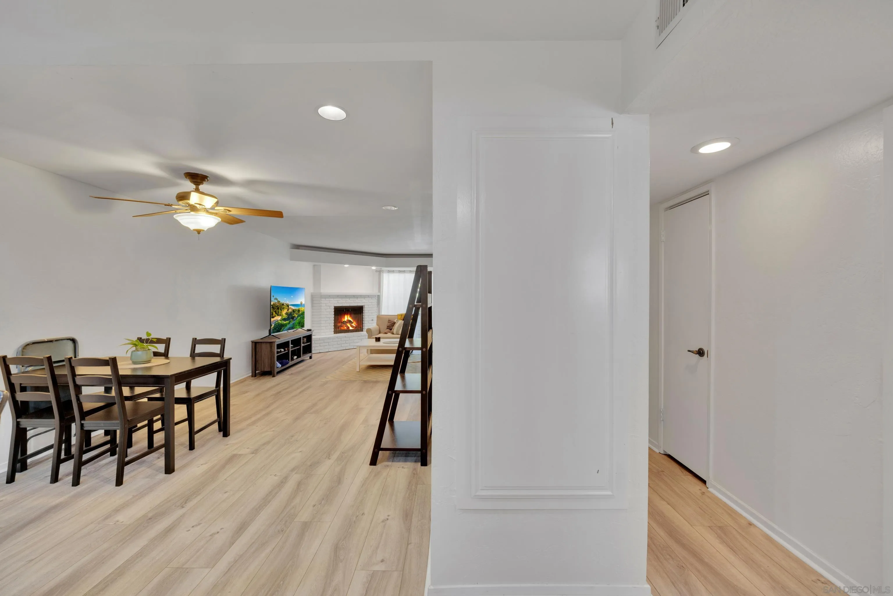 4055 Falcon Street, Unit 102 San Diego, CA 92103 - Photo 15 of 36 a view of a dining room with furniture and chandelier