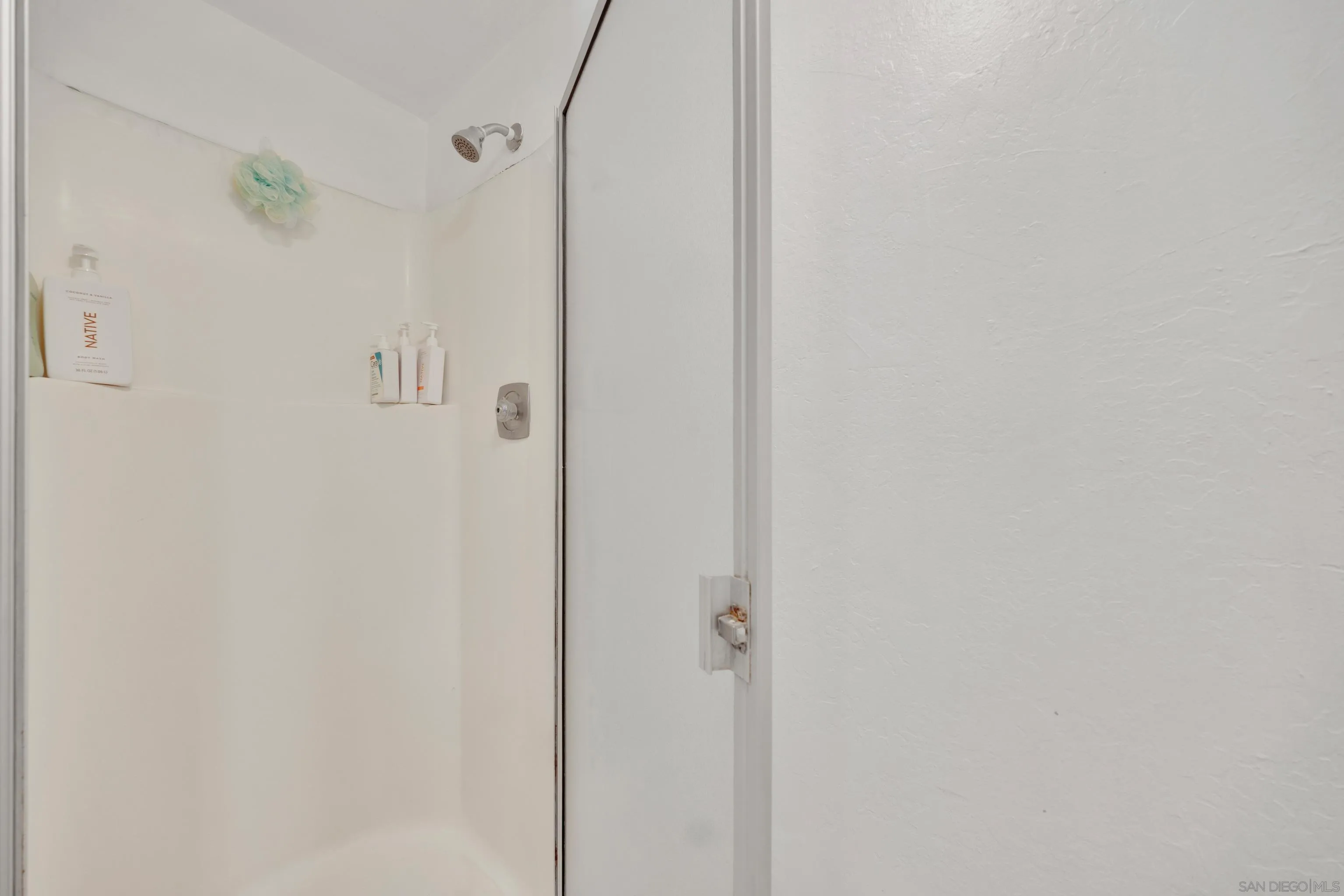 4055 Falcon Street, Unit 102 San Diego, CA 92103 - Photo 22 of 36 a bathroom with a shower