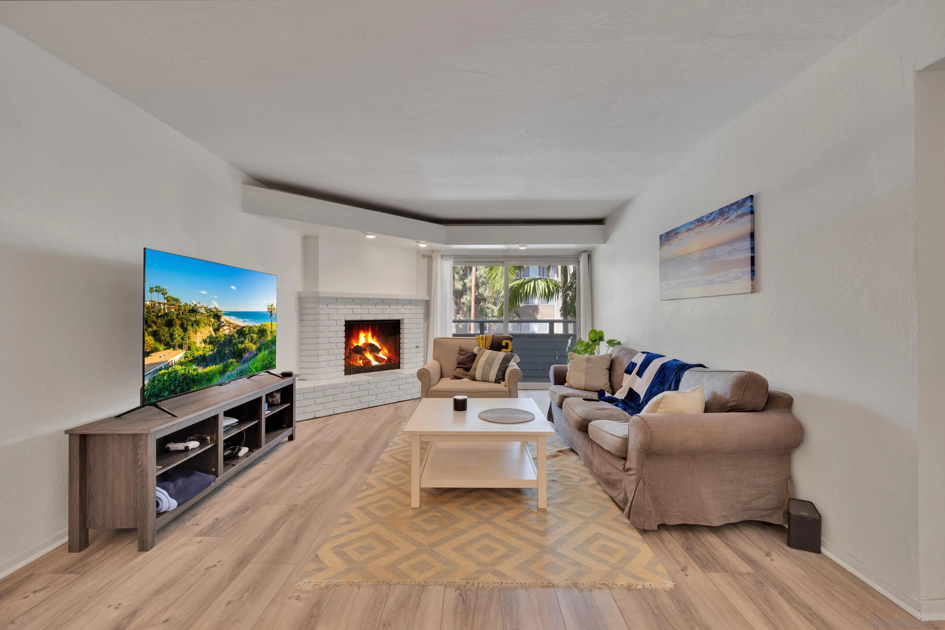 4055 Falcon Street, Unit 102 San Diego, CA 92103 - Photo 9 of 36 a living room with furniture and a flat screen tv