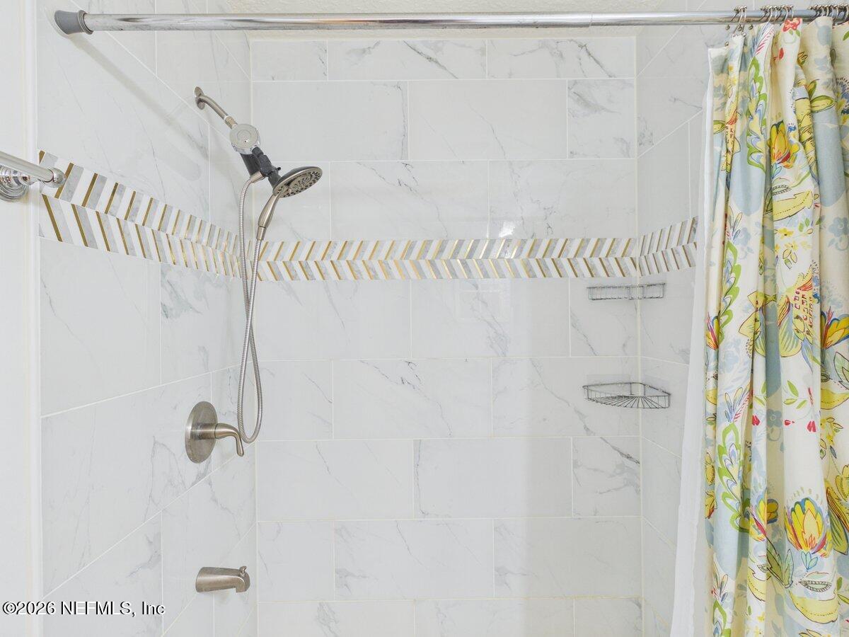 1240 4 Mile Road St. Augustine, FL 32084 - Photo 13 of 27 a bathroom with a shower