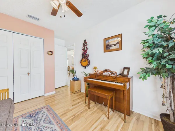 a living room with furniture and a potted plant