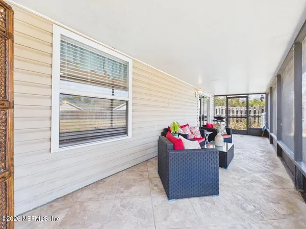 a living room with furniture and a window