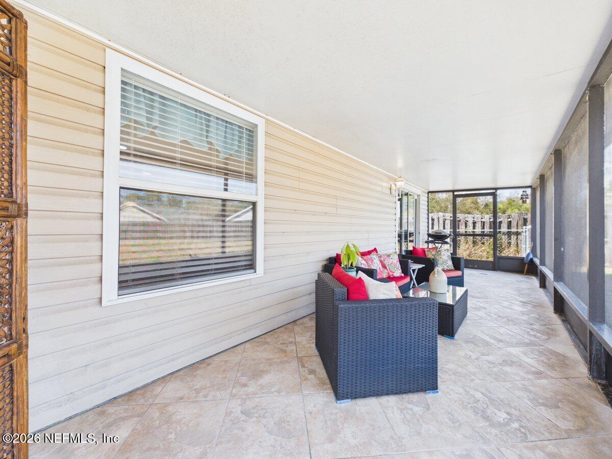 1240 4 Mile Road St. Augustine, FL 32084 - Photo 20 of 27 a living room with furniture and a window