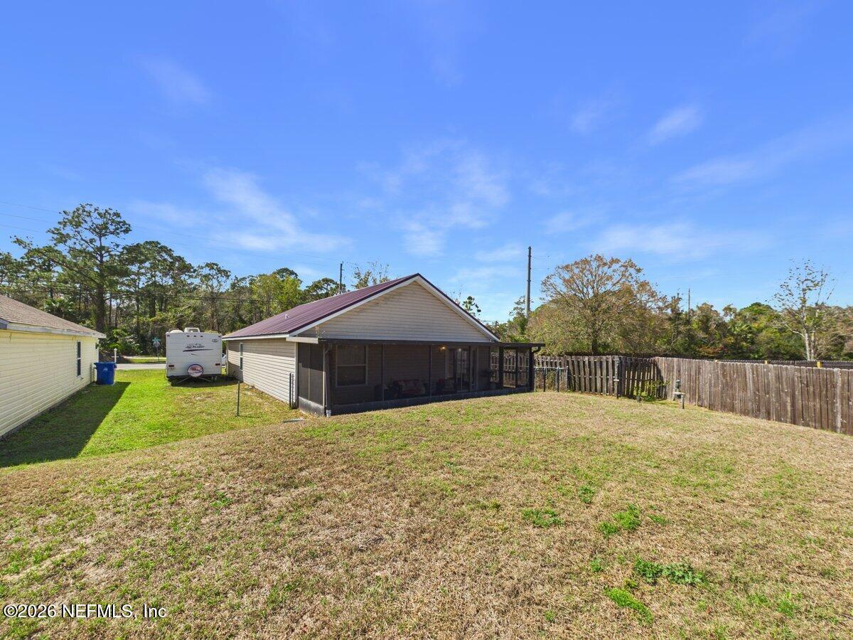 1240 4 Mile Road St. Augustine, FL 32084 - Photo 22 of 27 a house with trees in the background