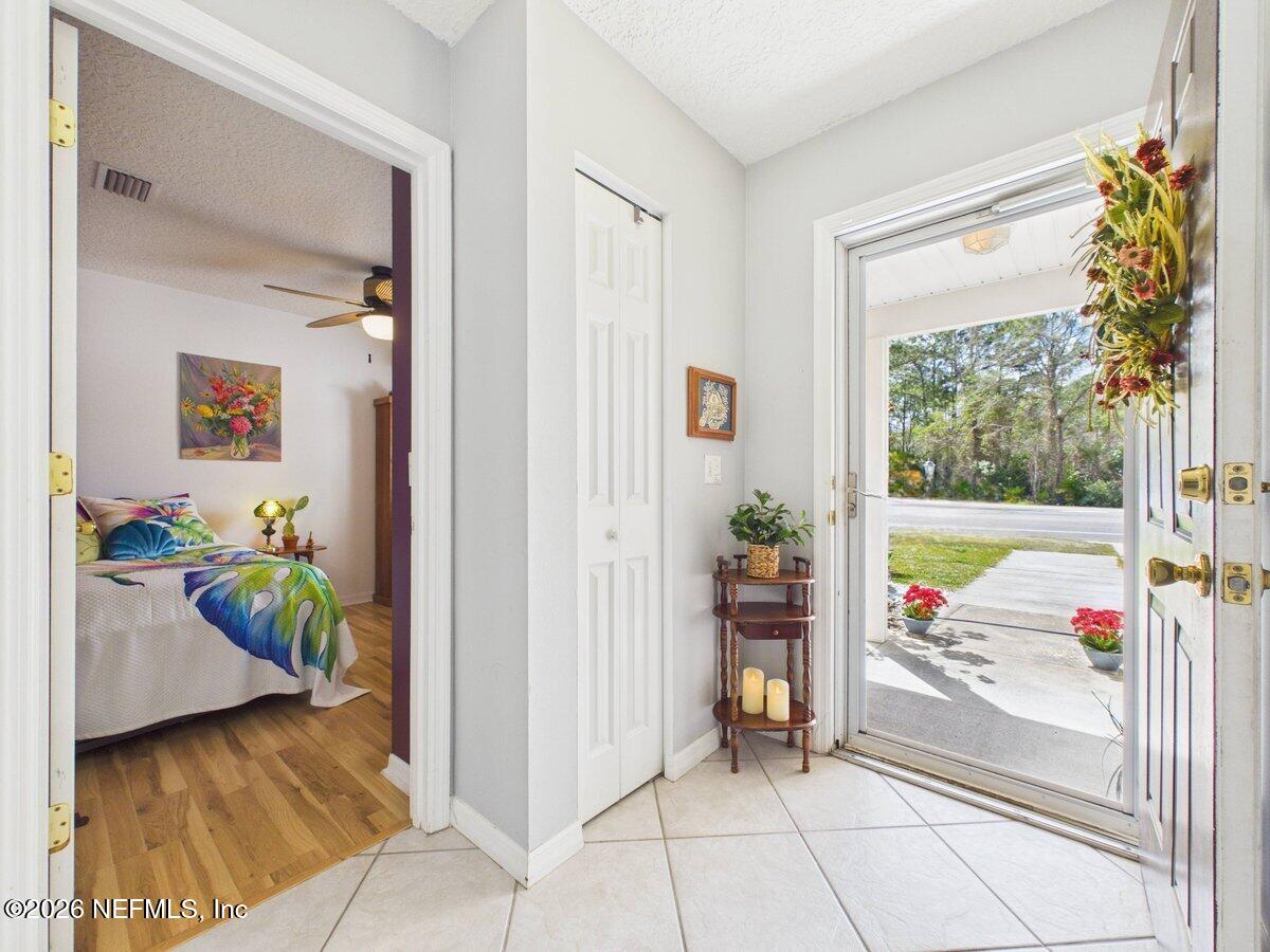 1240 4 Mile Road St. Augustine, FL 32084 - Photo 4 of 27 a view of a bedroom with window and tub