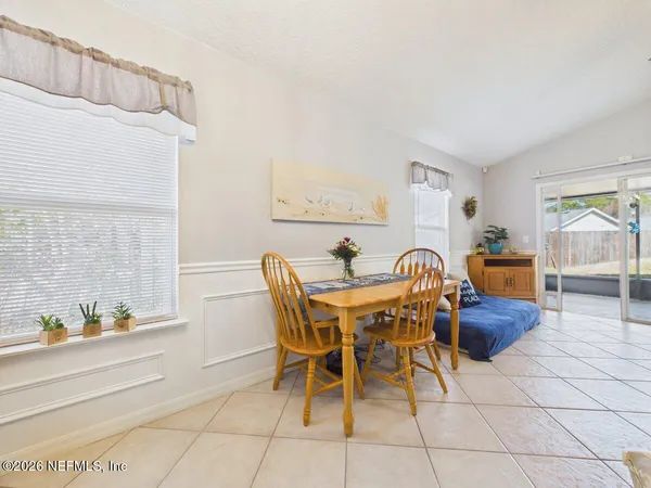 a view of a dining room with furniture