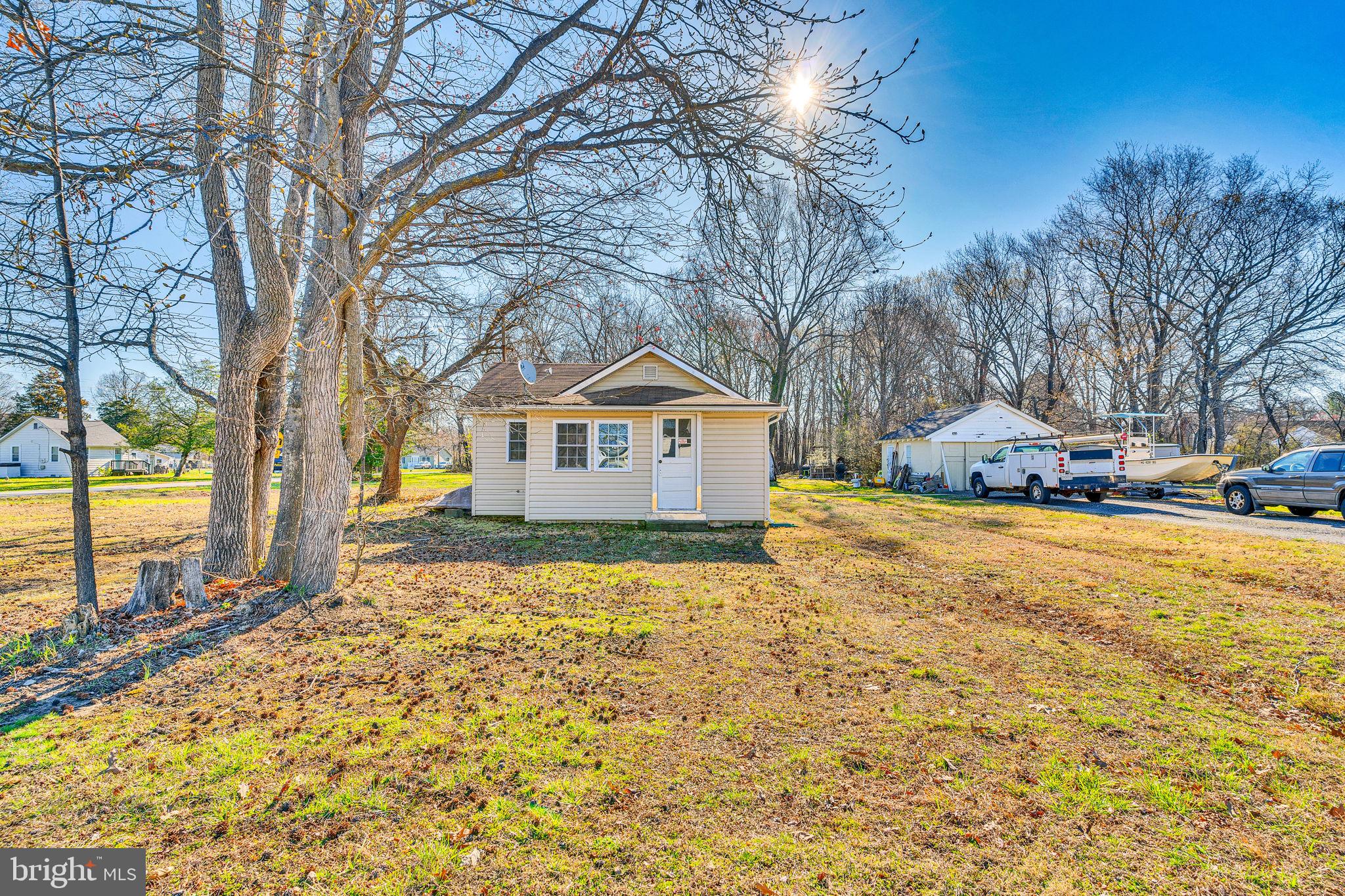 4871 Avery Road Shady Side, MD 20764 - Photo 1 of 20 a house with trees in front of it