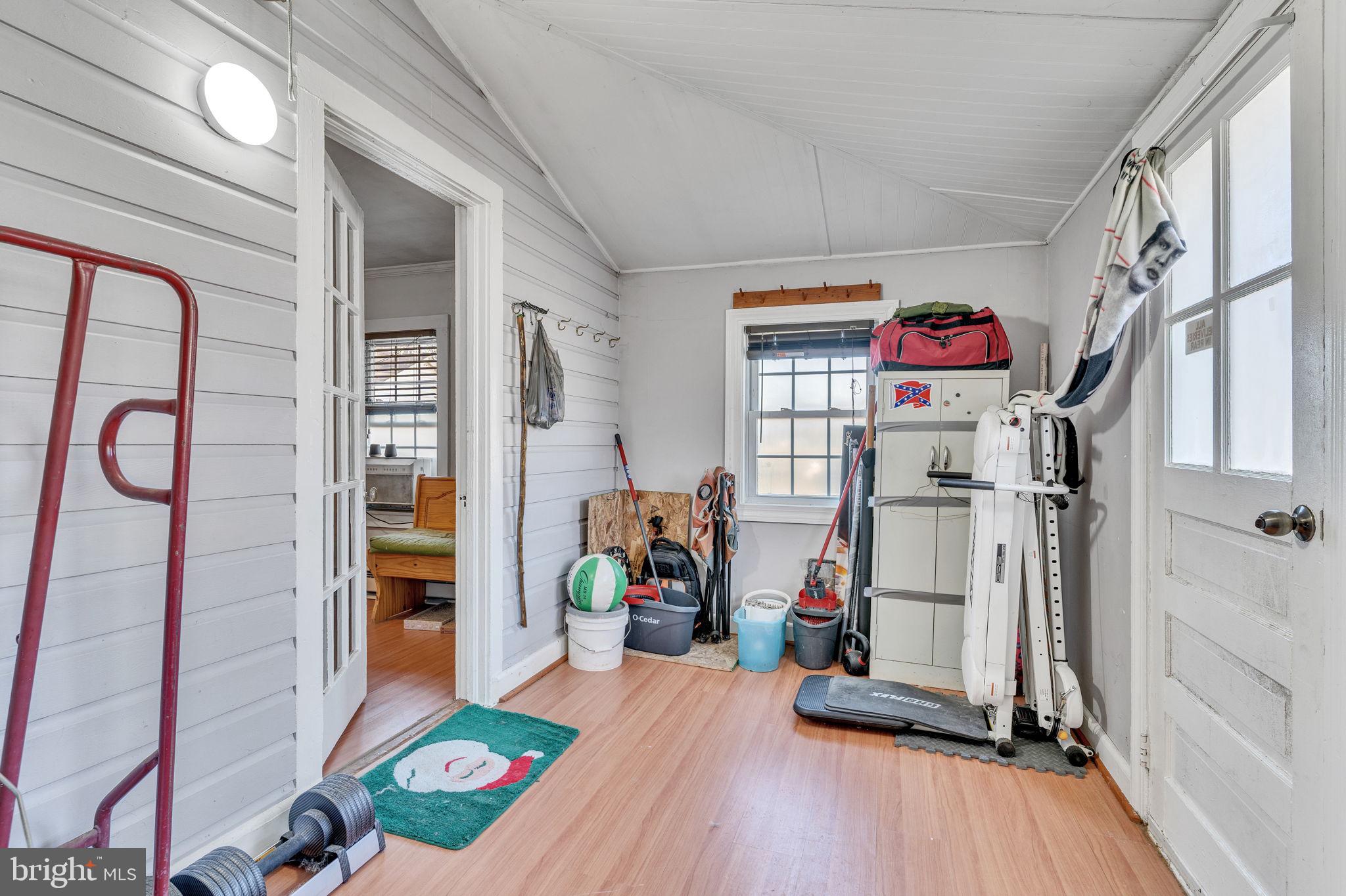 4871 Avery Road Shady Side, MD 20764 - Photo 2 of 20 a living room with furniture and a wooden floor