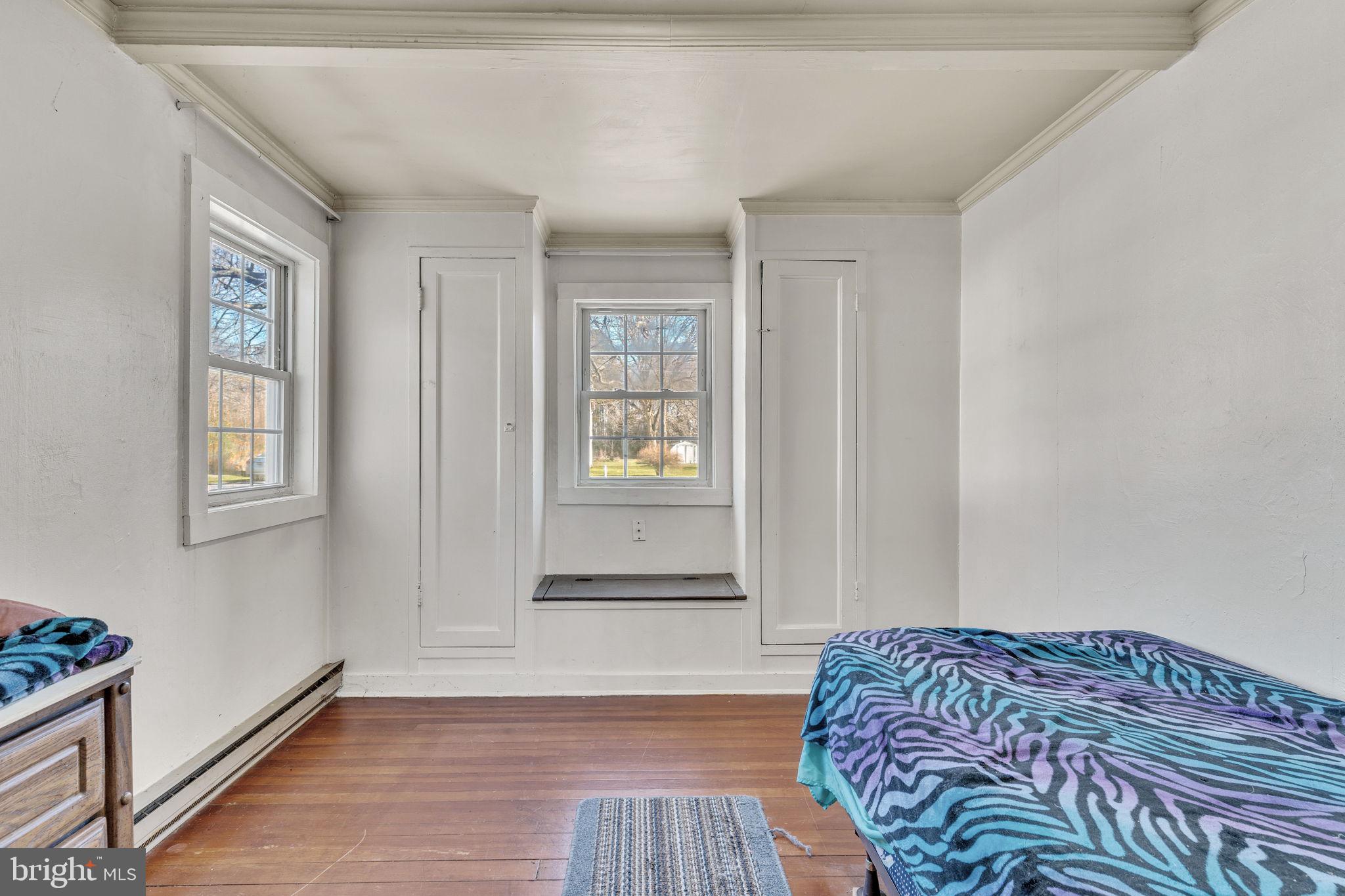 4871 Avery Road Shady Side, MD 20764 - Photo 5 of 20 a bedroom with a bed and a window