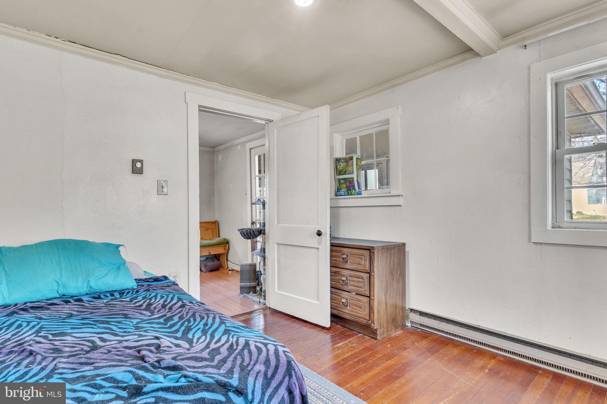 4871 Avery Road Shady Side, MD 20764 - Photo 7 of 20 a bedroom with a bed and a window