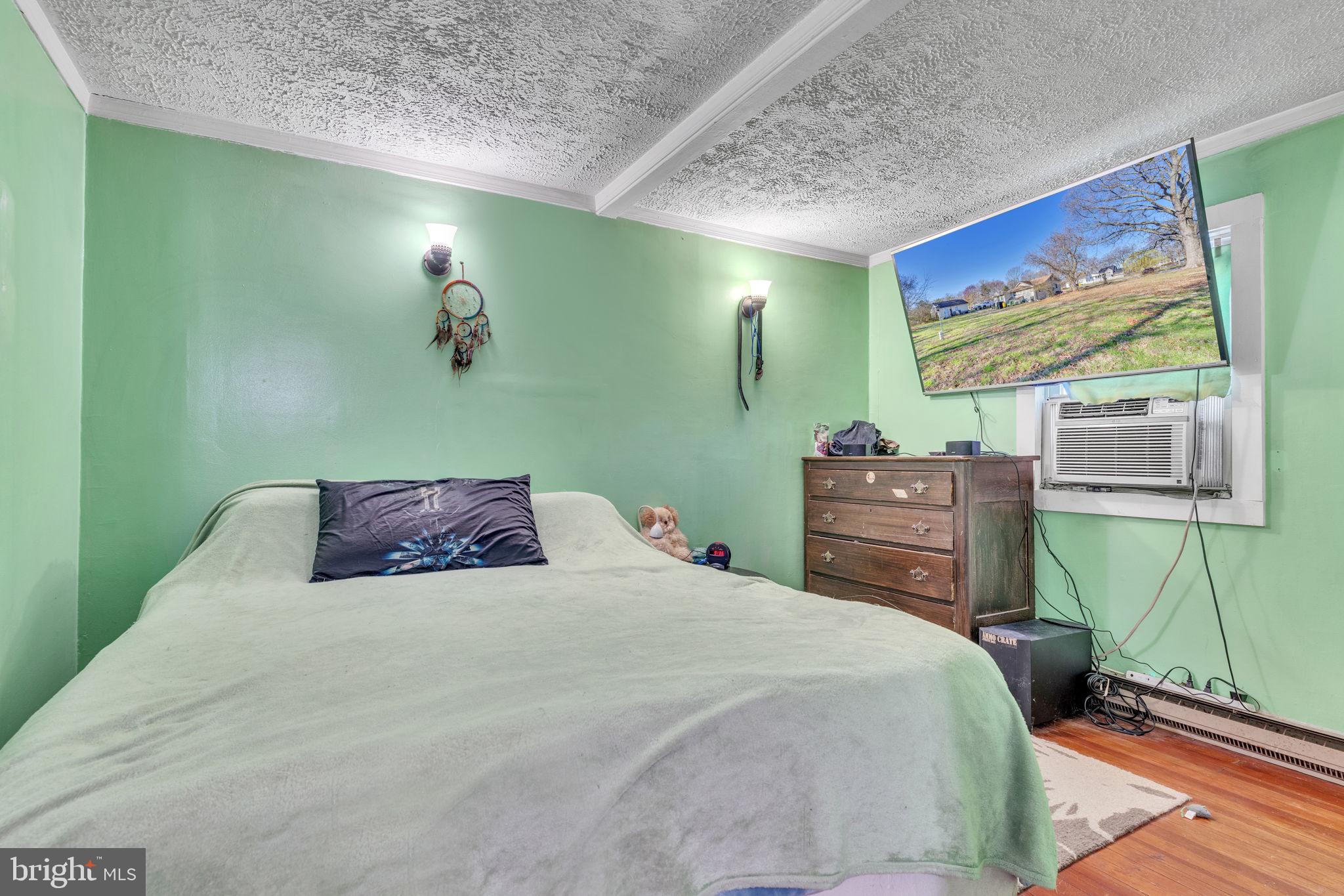4871 Avery Road Shady Side, MD 20764 - Photo 8 of 20 a bedroom with a bed and window