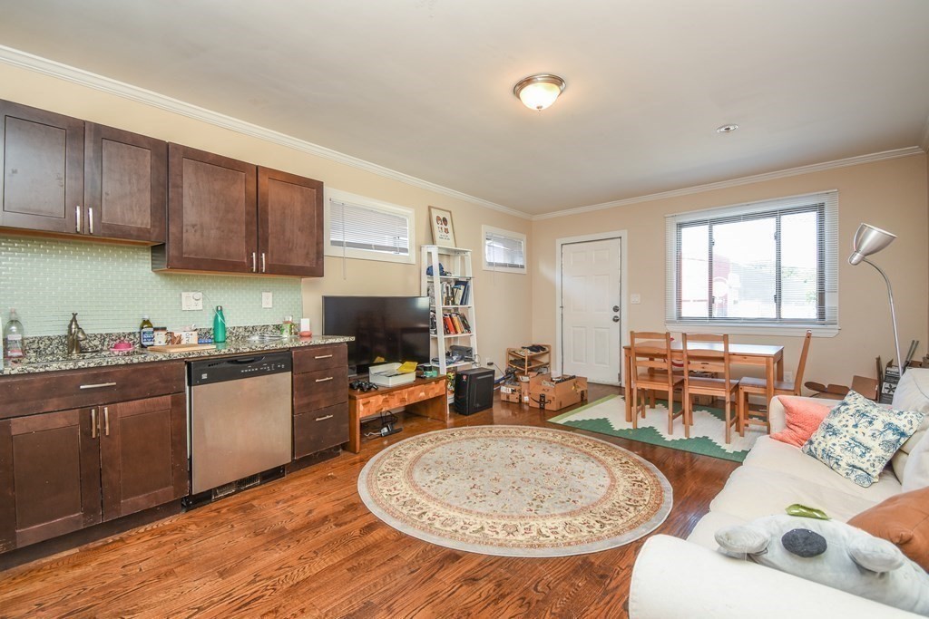 75 Elm Street Watertown, MA 02472 - Photo 5 of 12 a living room with furniture a wooden floor and a sink
