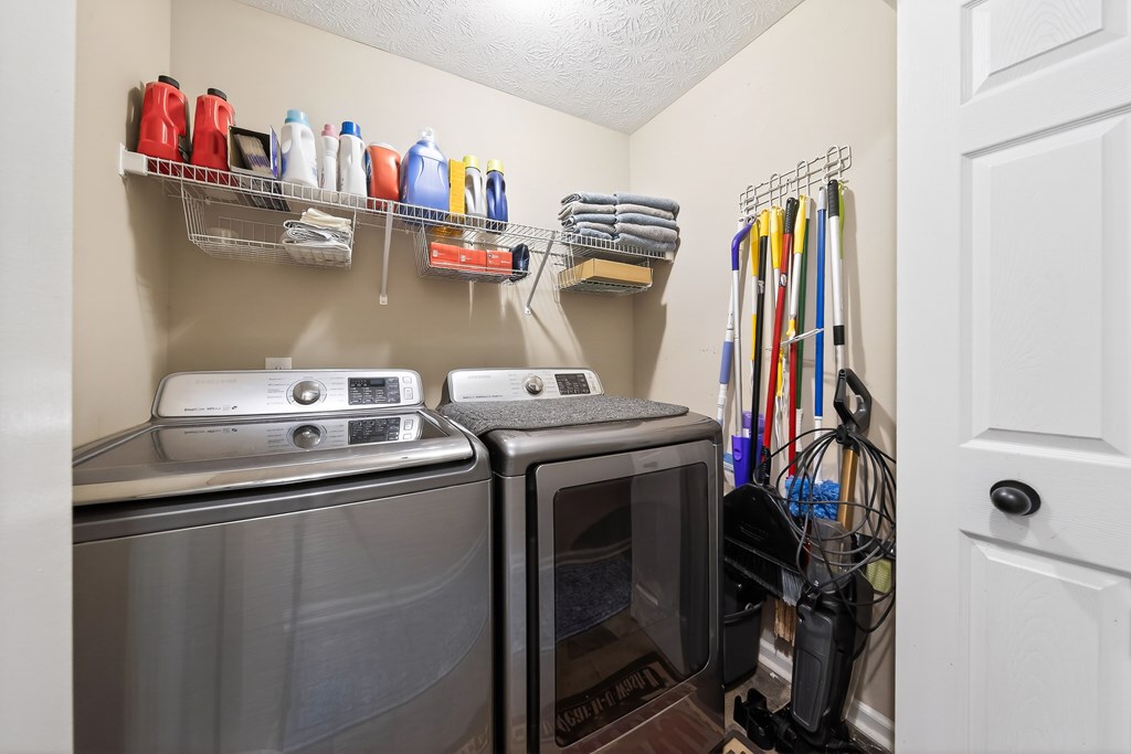 7333 Cedar Creek Loop Columbus, GA 31904 - Photo 16 of 37 a view of walk in closet with clothes and shoes