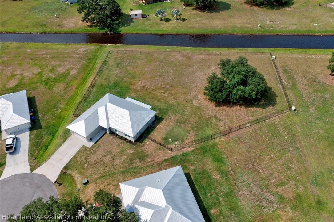 111 Vale Court Sebring, FL 33876 - Photo 35 of 40 a view of a lake with a building in the background