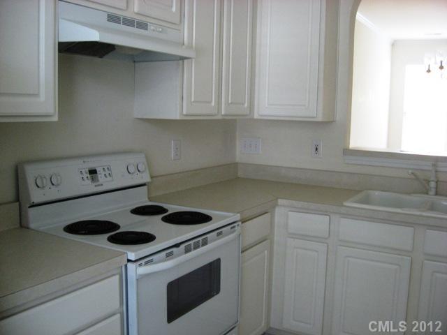 733 Shellstone Place, Unit 733 Fort Mill, SC 29708 - Photo 3 of 16 a kitchen with a stove cabinets and a sink