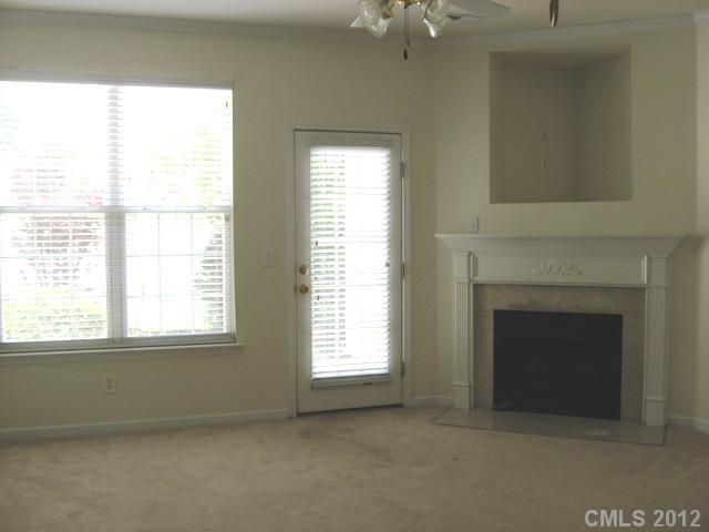 733 Shellstone Place, Unit 733 Fort Mill, SC 29708 - Photo 6 of 16 a view of an empty room with a fireplace and a window