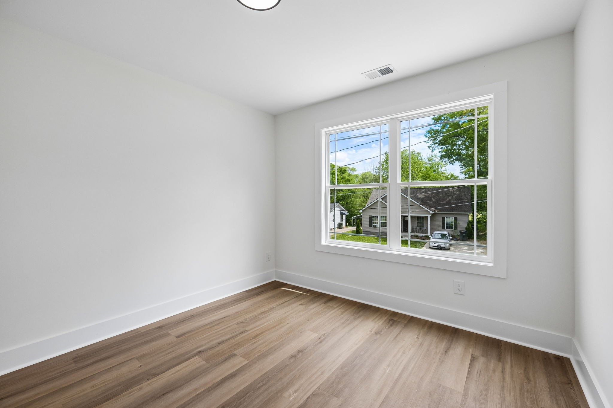 419 North Mabel Street Springfield, TN 37172 - Photo 28 of 34 a view of an empty room with wooden floor and a window