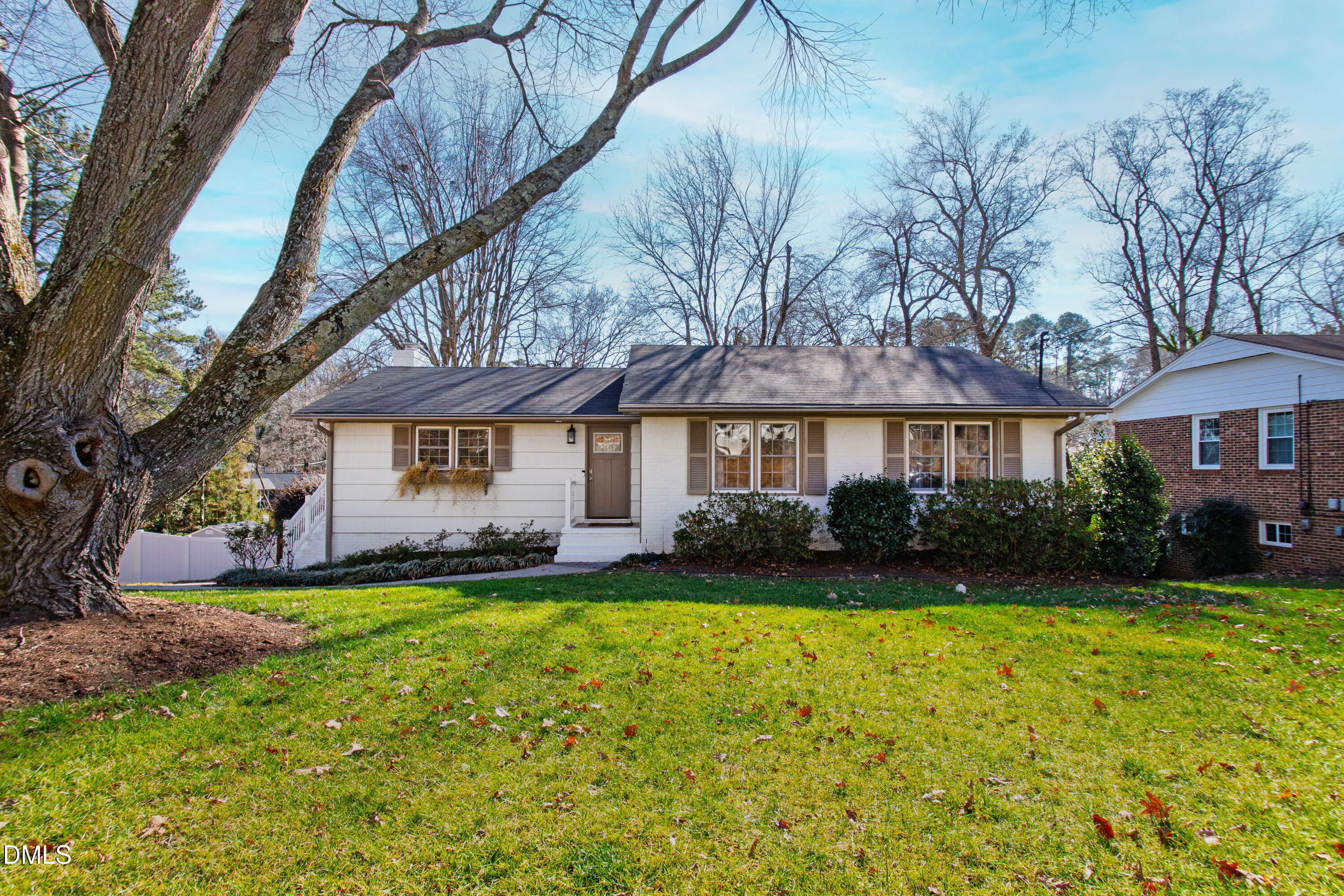 211 Northfield Drive Raleigh, NC 27609 - Photo 1 of 49 a view of a house with a big yard and potted plants