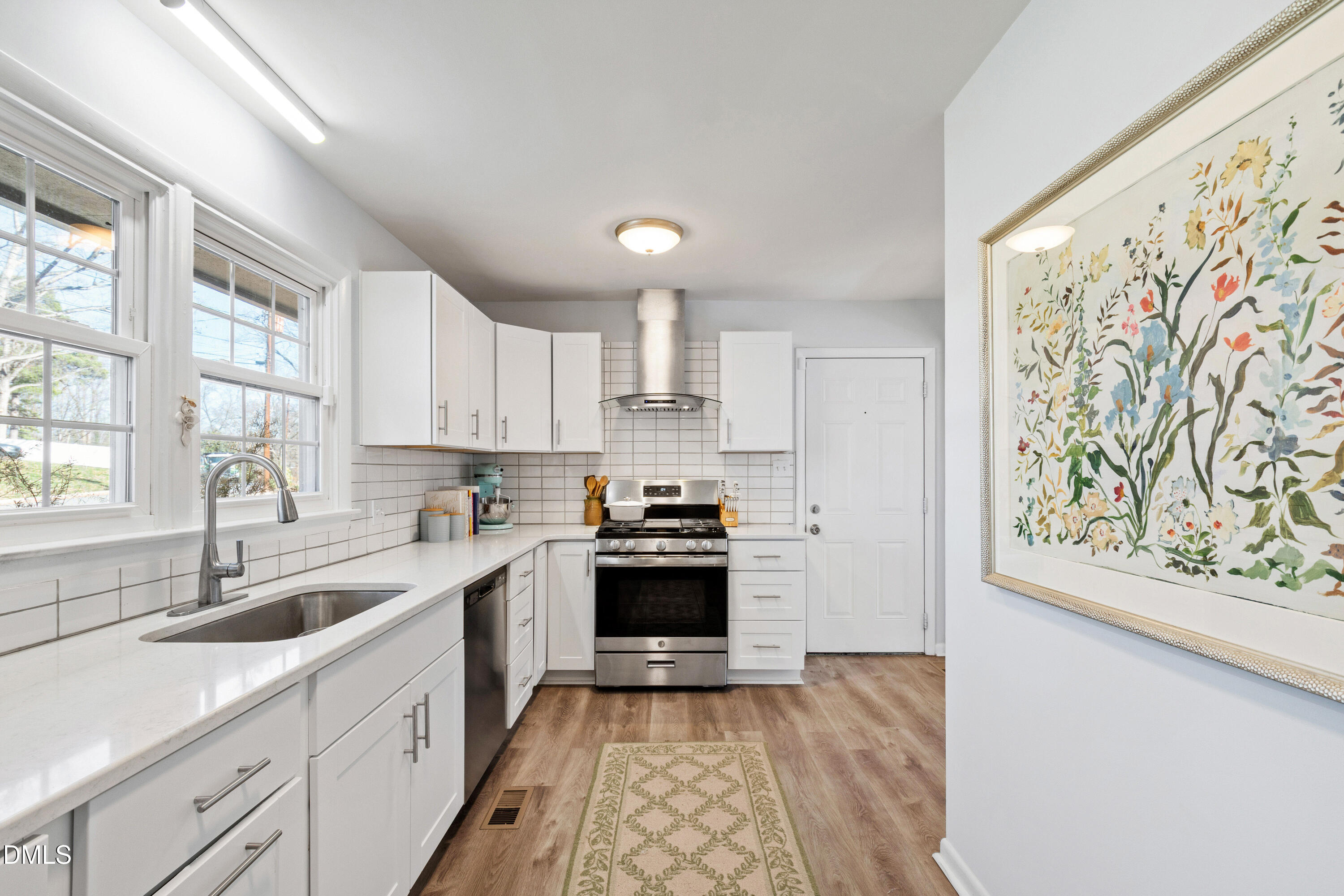 211 Northfield Drive Raleigh, NC 27609 - Photo 14 of 49 a kitchen with stainless steel appliances granite countertop a sink stove and refrigerator