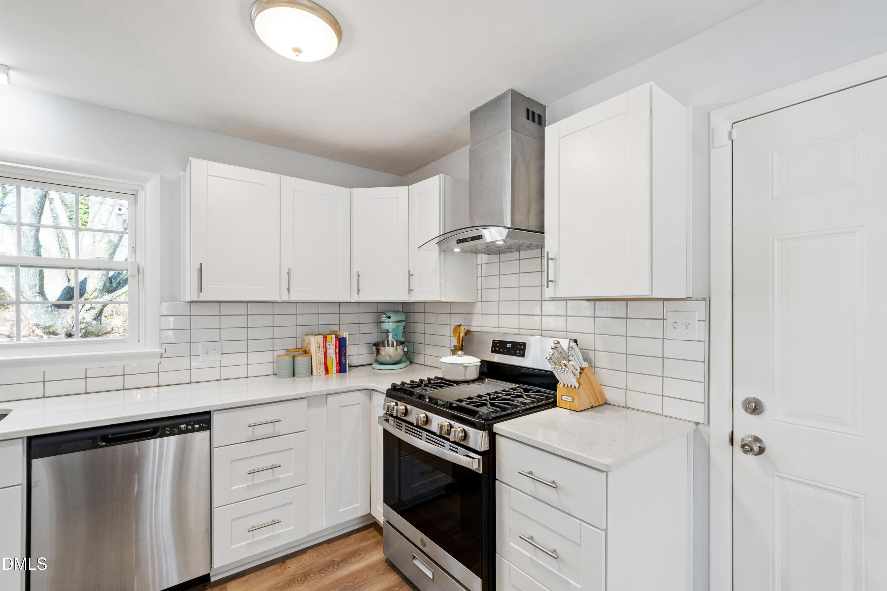 211 Northfield Drive Raleigh, NC 27609 - Photo 15 of 49 a kitchen with white cabinets stainless steel appliances and sink