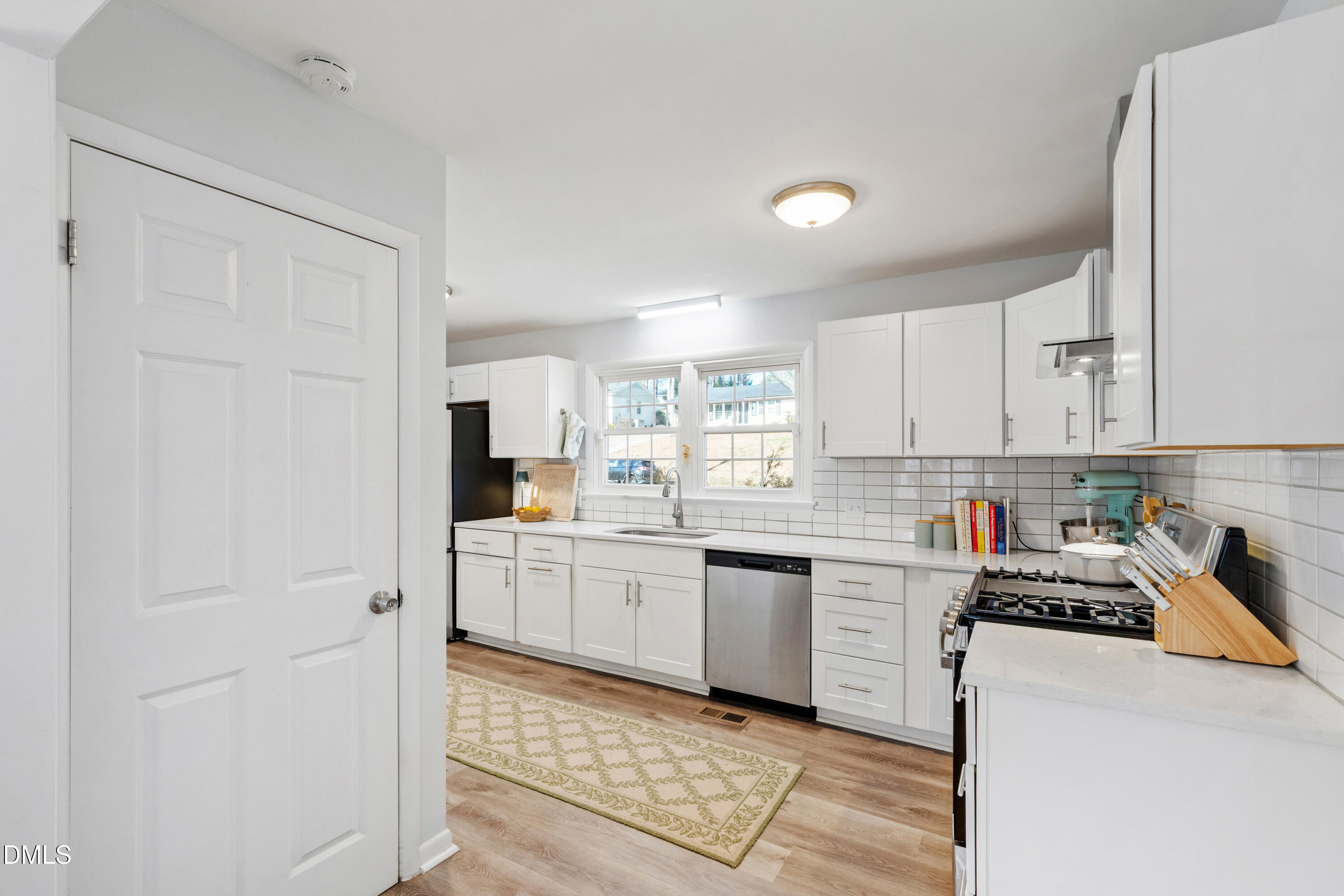 211 Northfield Drive Raleigh, NC 27609 - Photo 16 of 49 a kitchen with cabinets and stainless steel appliances