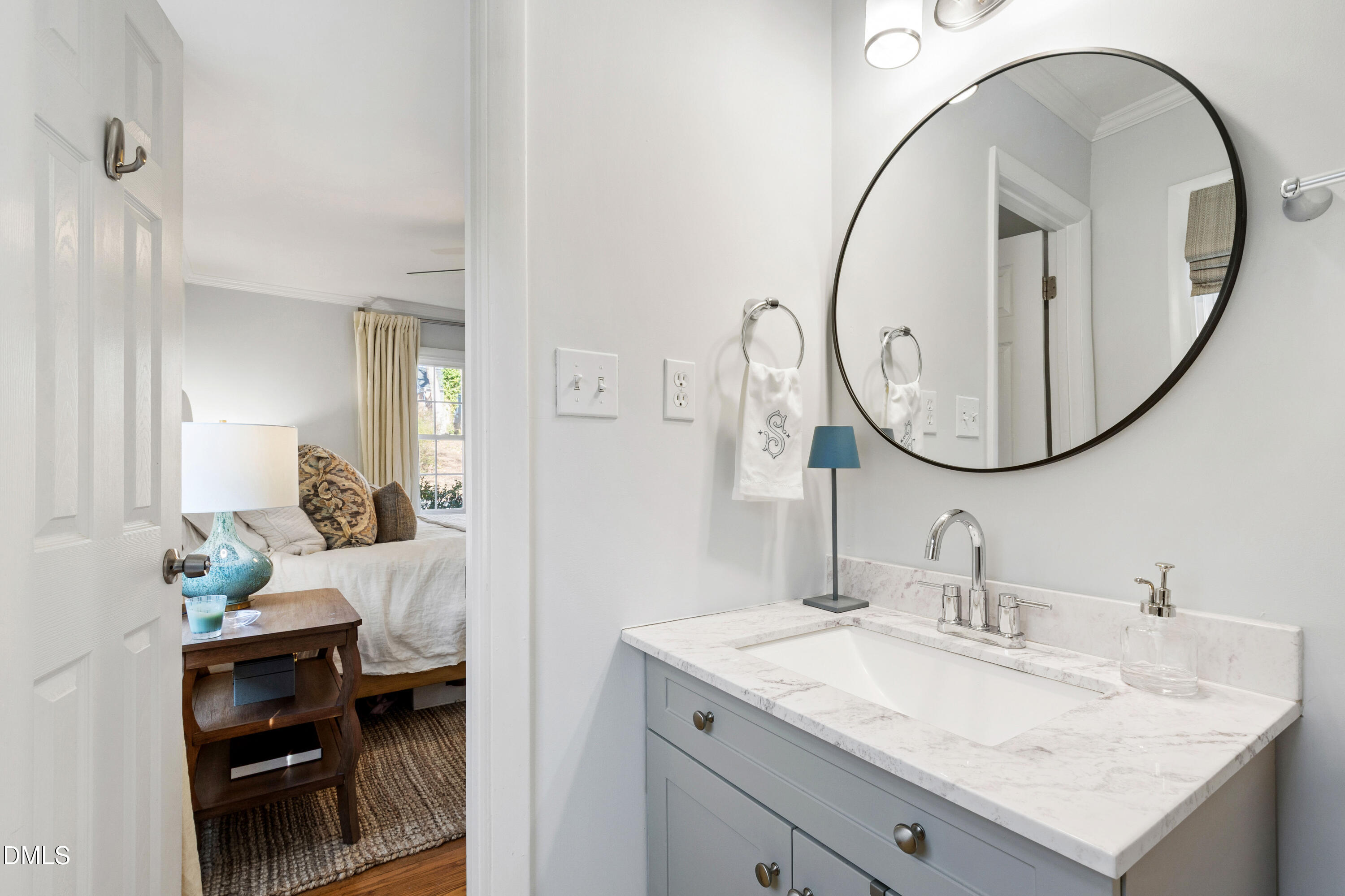 211 Northfield Drive Raleigh, NC 27609 - Photo 20 of 49 a en suite bathroom with a granite countertop sink and a mirror