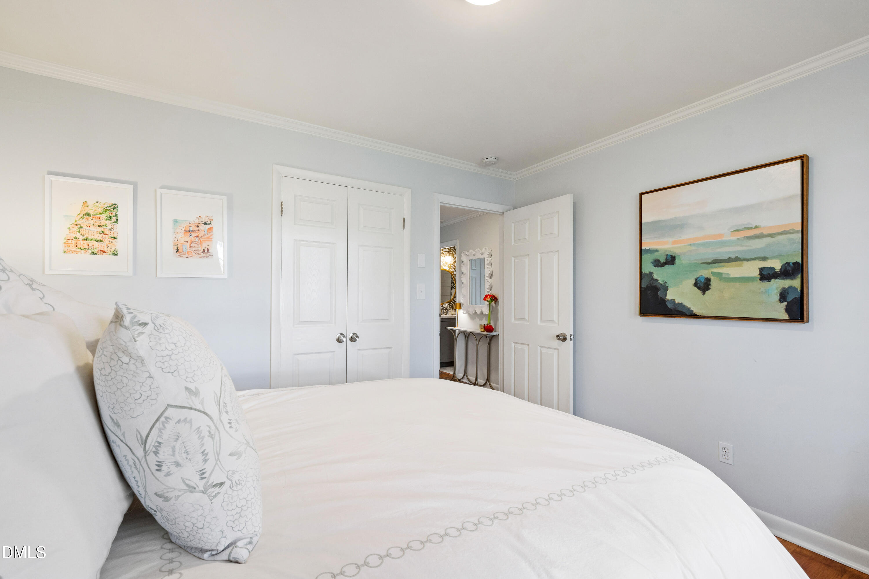 211 Northfield Drive Raleigh, NC 27609 - Photo 23 of 49 a bed room with a bed and a painting on the wall