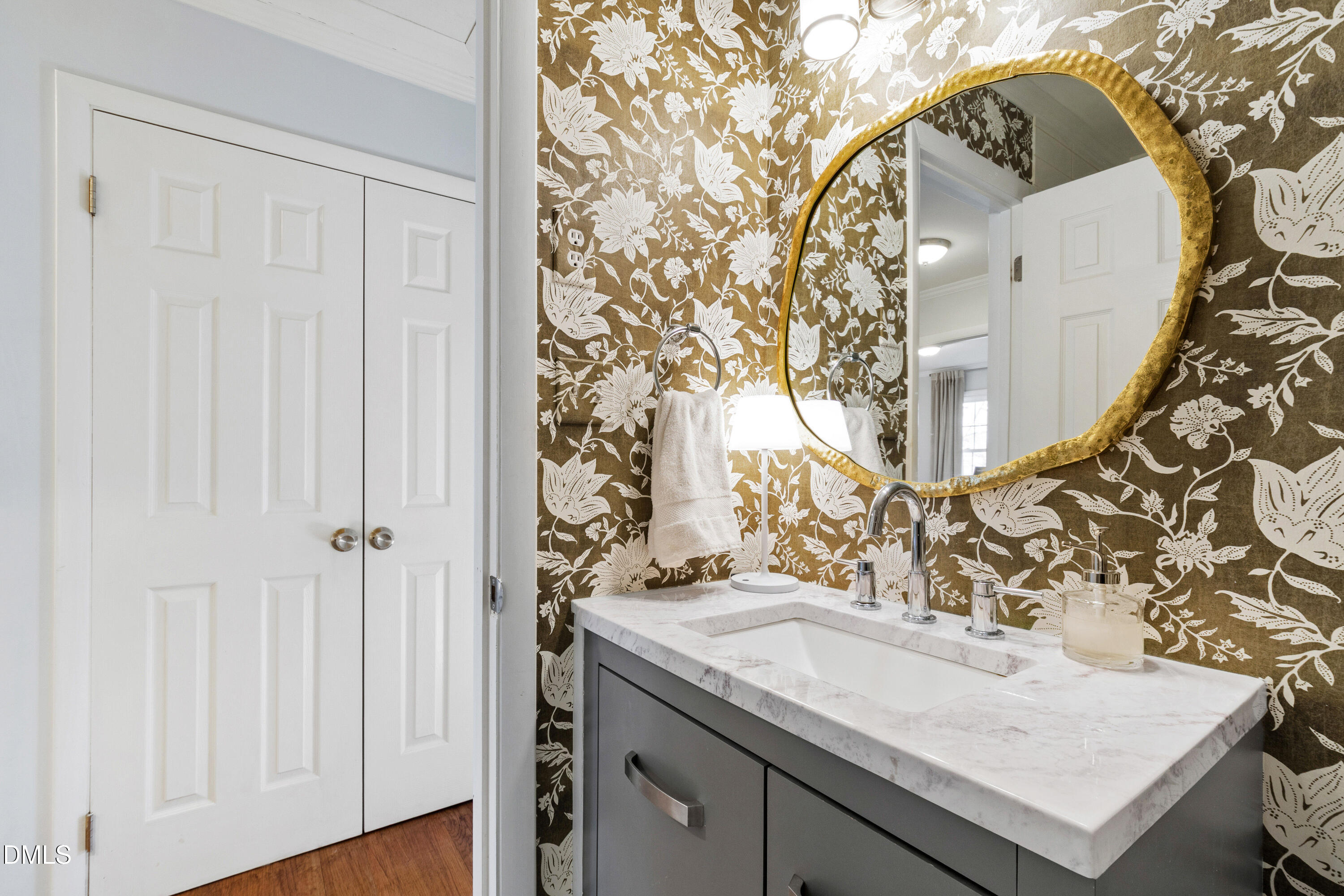 211 Northfield Drive Raleigh, NC 27609 - Photo 24 of 49 an view of a bathroom with a sink and mirror
