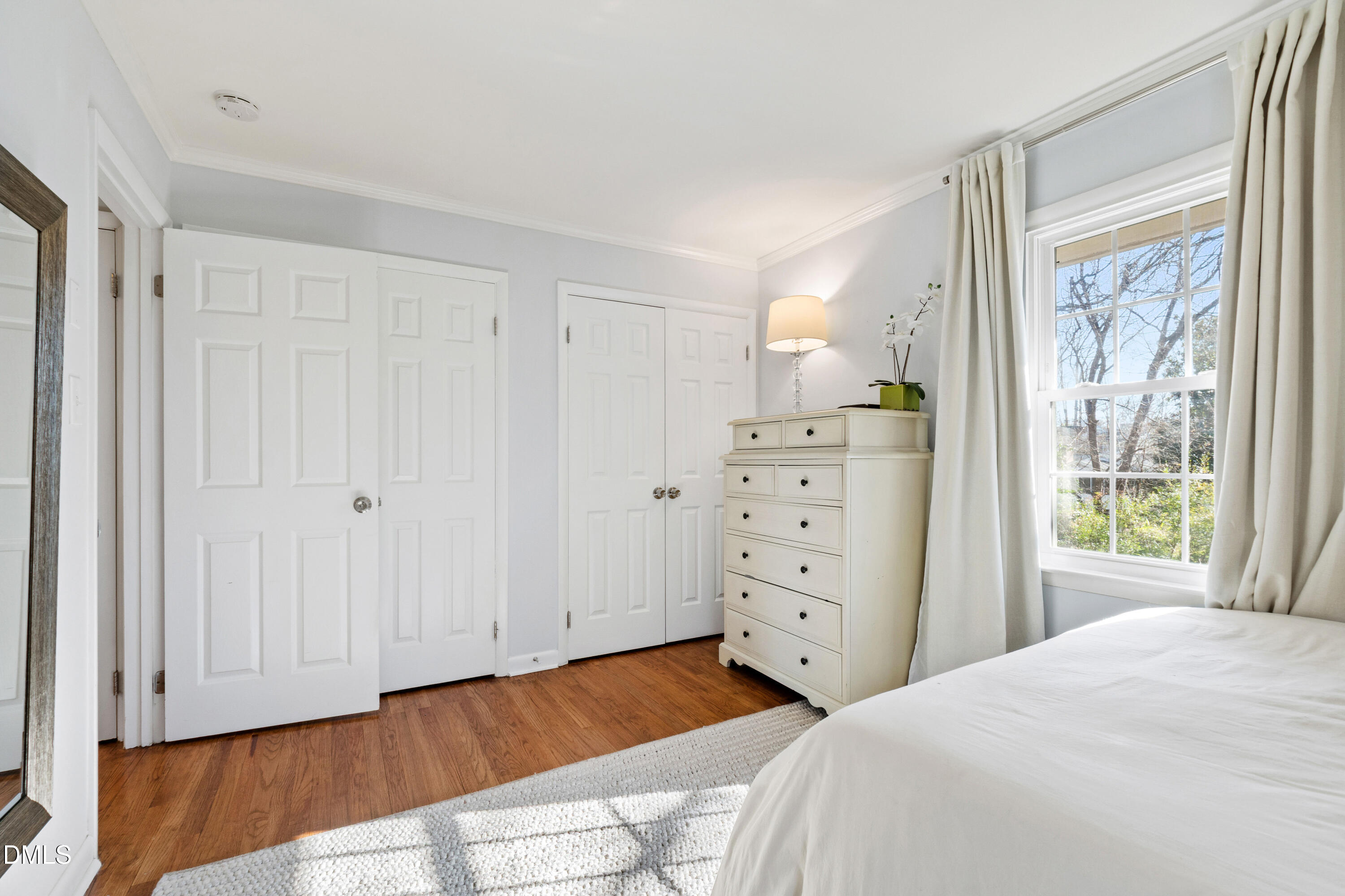 211 Northfield Drive Raleigh, NC 27609 - Photo 27 of 49 a bedroom with a bed and a window