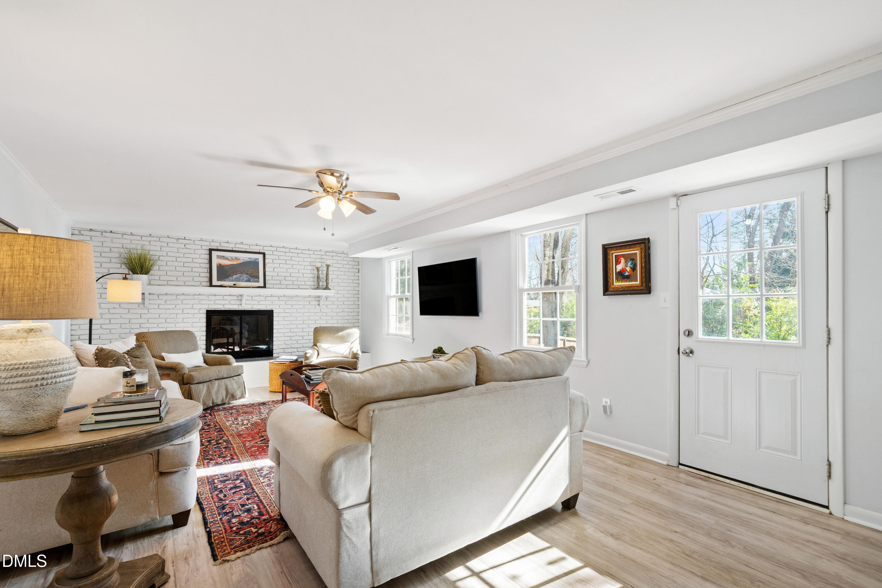 211 Northfield Drive Raleigh, NC 27609 - Photo 28 of 49 a living room with fireplace furniture and a flat screen tv