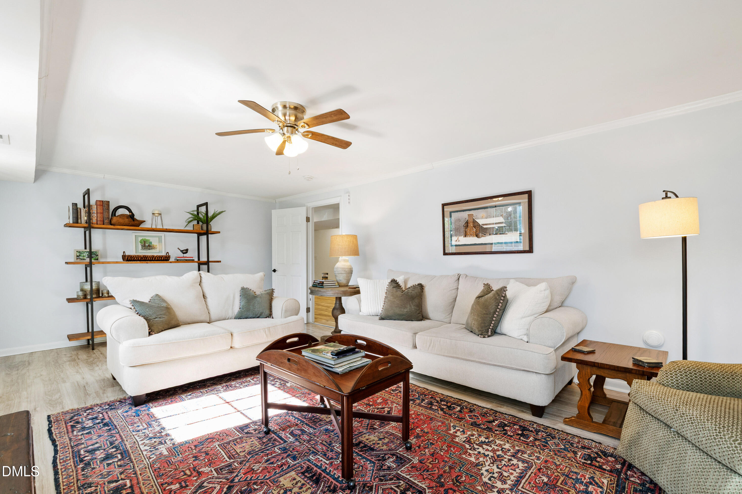 211 Northfield Drive Raleigh, NC 27609 - Photo 30 of 49 a living room with furniture a rug and a lamp