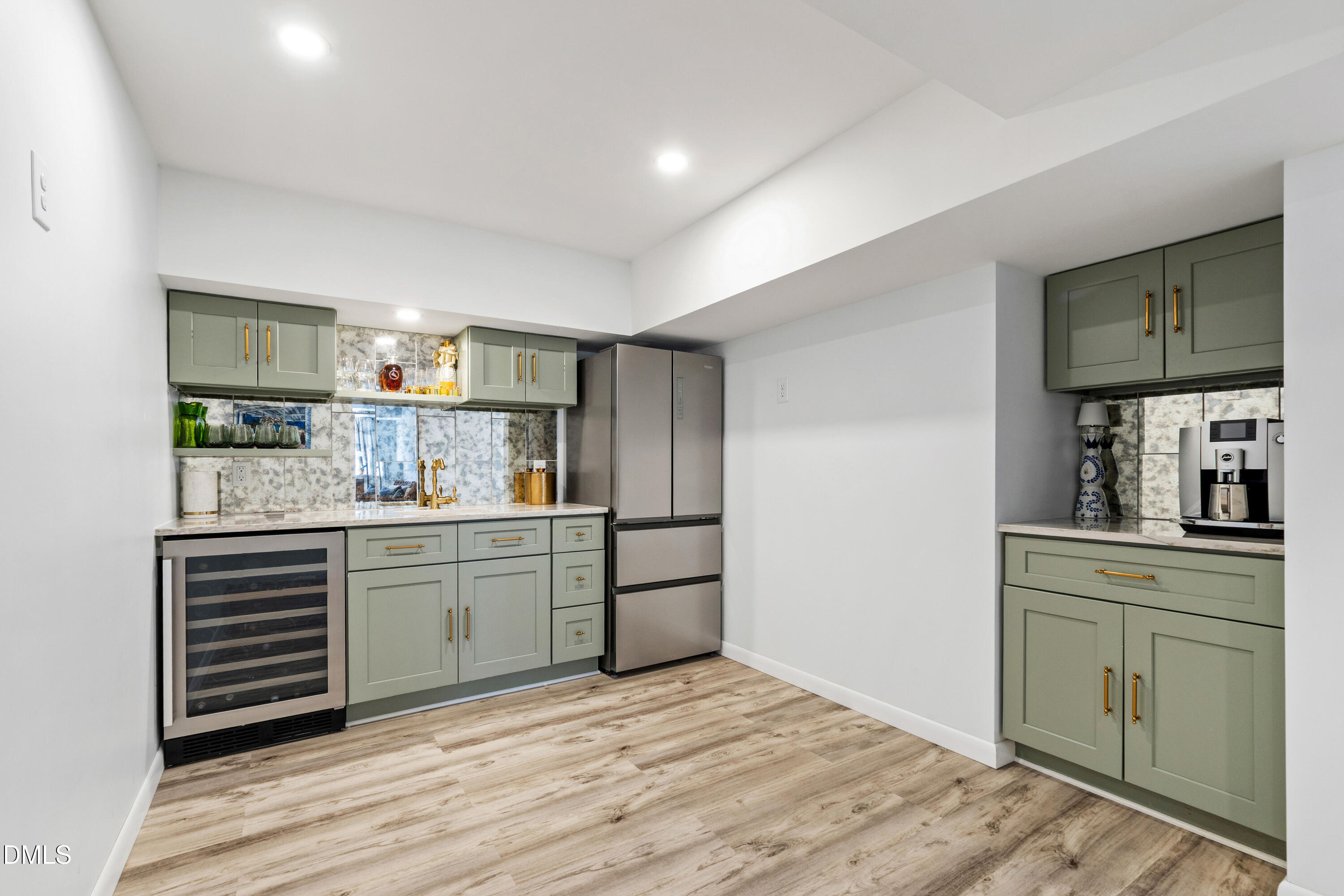 211 Northfield Drive Raleigh, NC 27609 - Photo 31 of 49 a kitchen with granite countertop a sink cabinets and stainless steel appliances