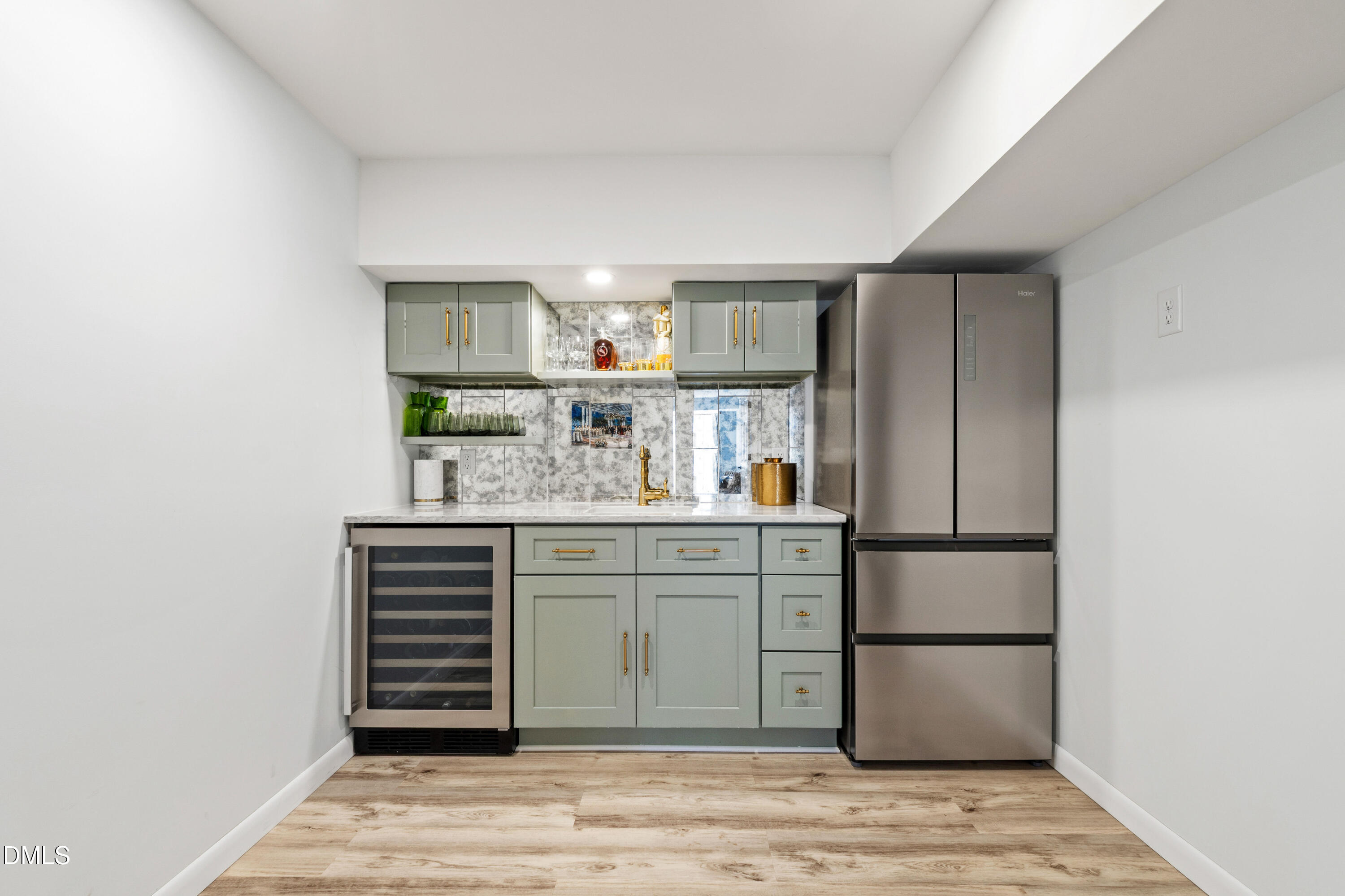 211 Northfield Drive Raleigh, NC 27609 - Photo 32 of 49 a kitchen with a refrigerator and cabinets