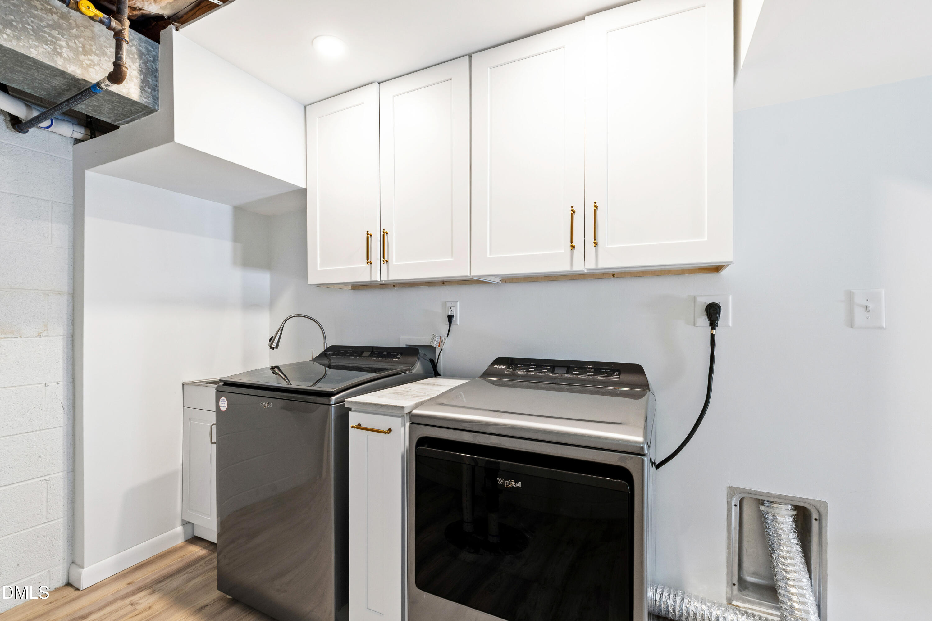 211 Northfield Drive Raleigh, NC 27609 - Photo 38 of 49 a utility room with stainless steel appliances granite countertop a sink stove and cabinets