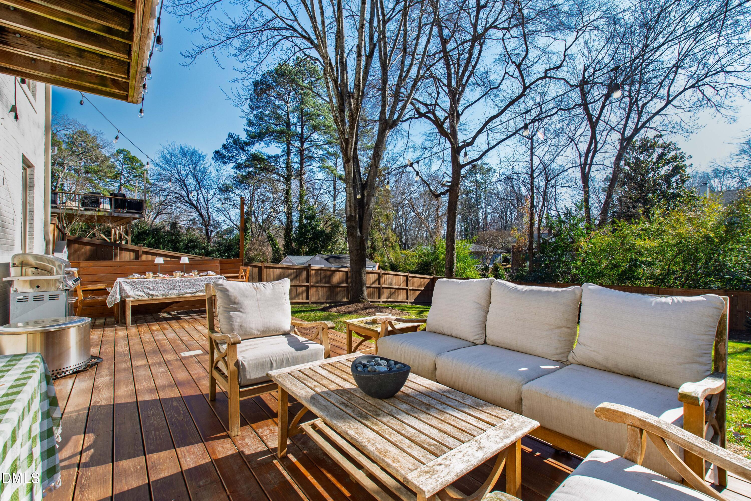 211 Northfield Drive Raleigh, NC 27609 - Photo 39 of 49 a view of patio with couches and a fire pit
