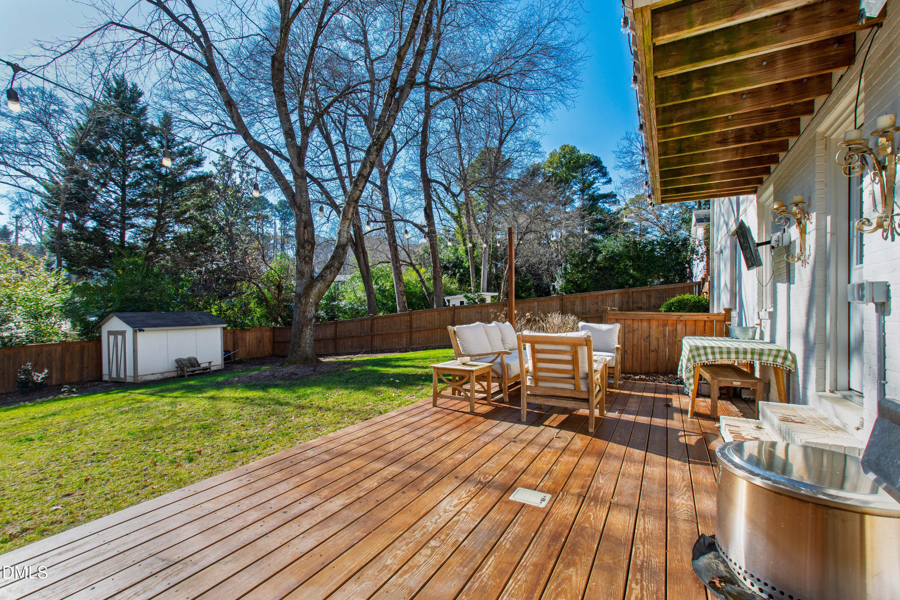 211 Northfield Drive Raleigh, NC 27609 - Photo 41 of 49 a view of a chairs and table on the wooden deck