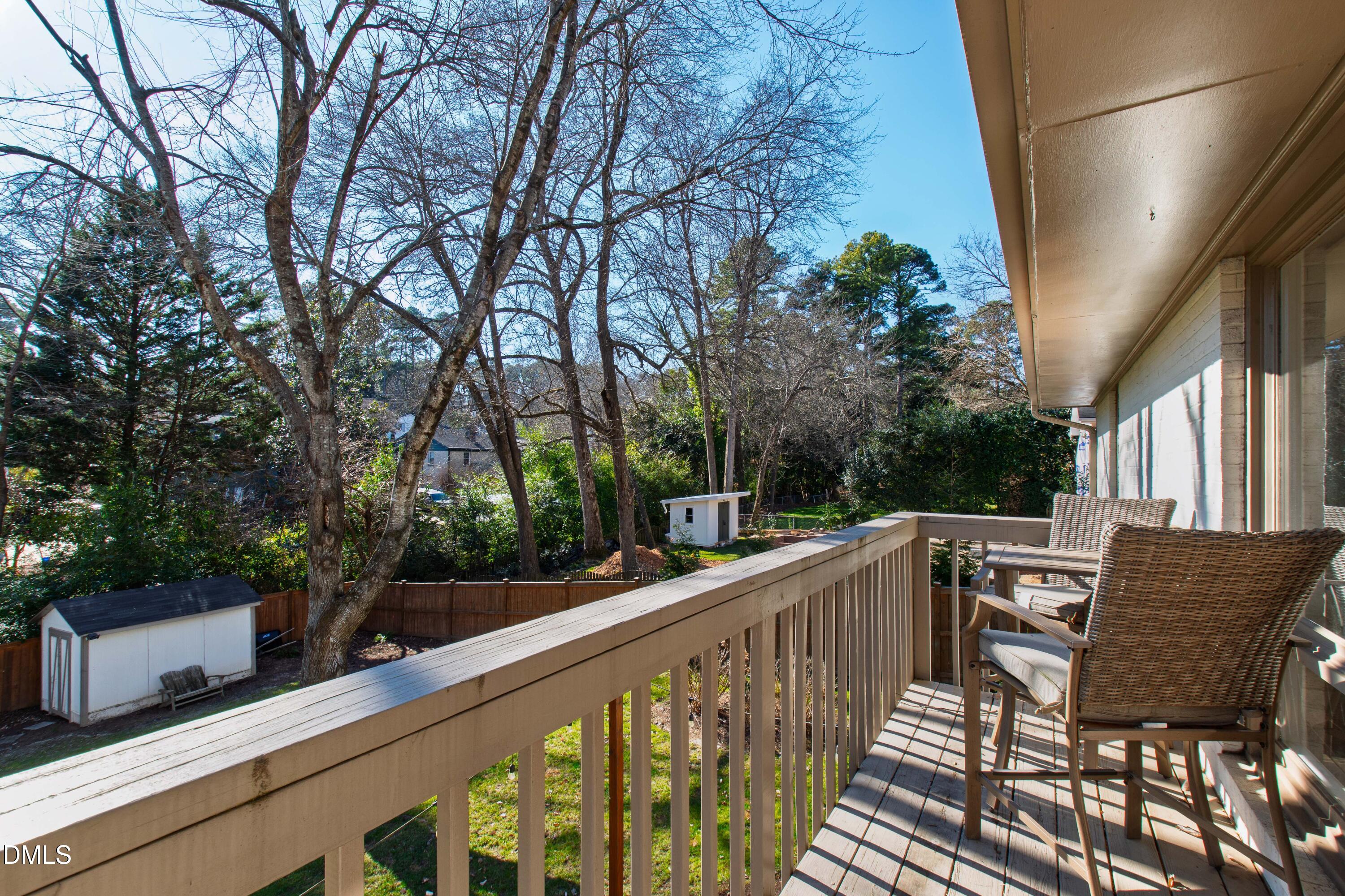 211 Northfield Drive Raleigh, NC 27609 - Photo 44 of 49 a view of a chairs and table in the balcony