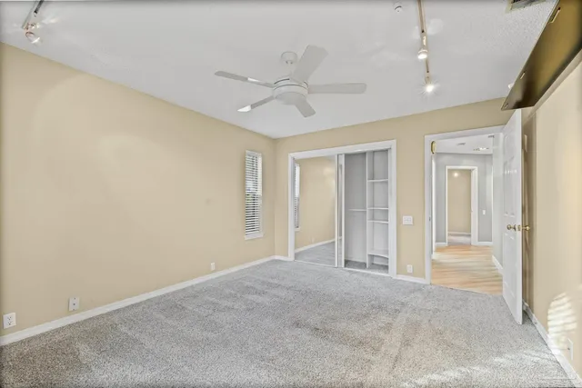 a view of a room with wooden floor and balcony