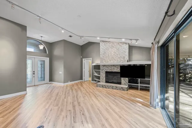 a room with a bed and a chair in it