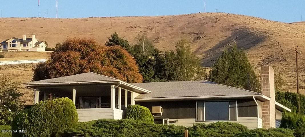 708 Meadowbrook Road Yakima, WA 98903 - Photo 1 of 65 a front view of a house with a yard