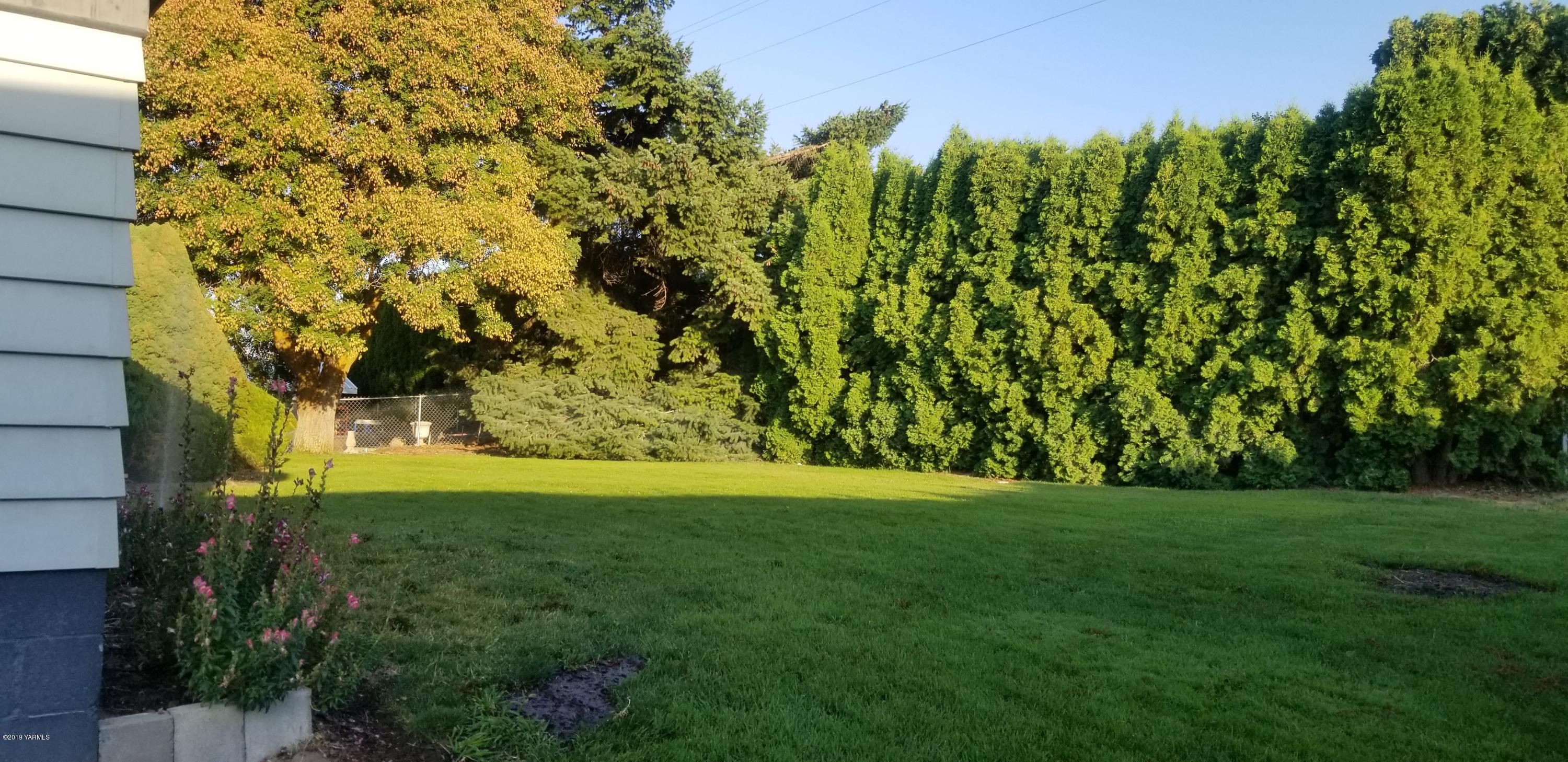 708 Meadowbrook Road Yakima, WA 98903 - Photo 13 of 65 a view of a trees with a yard