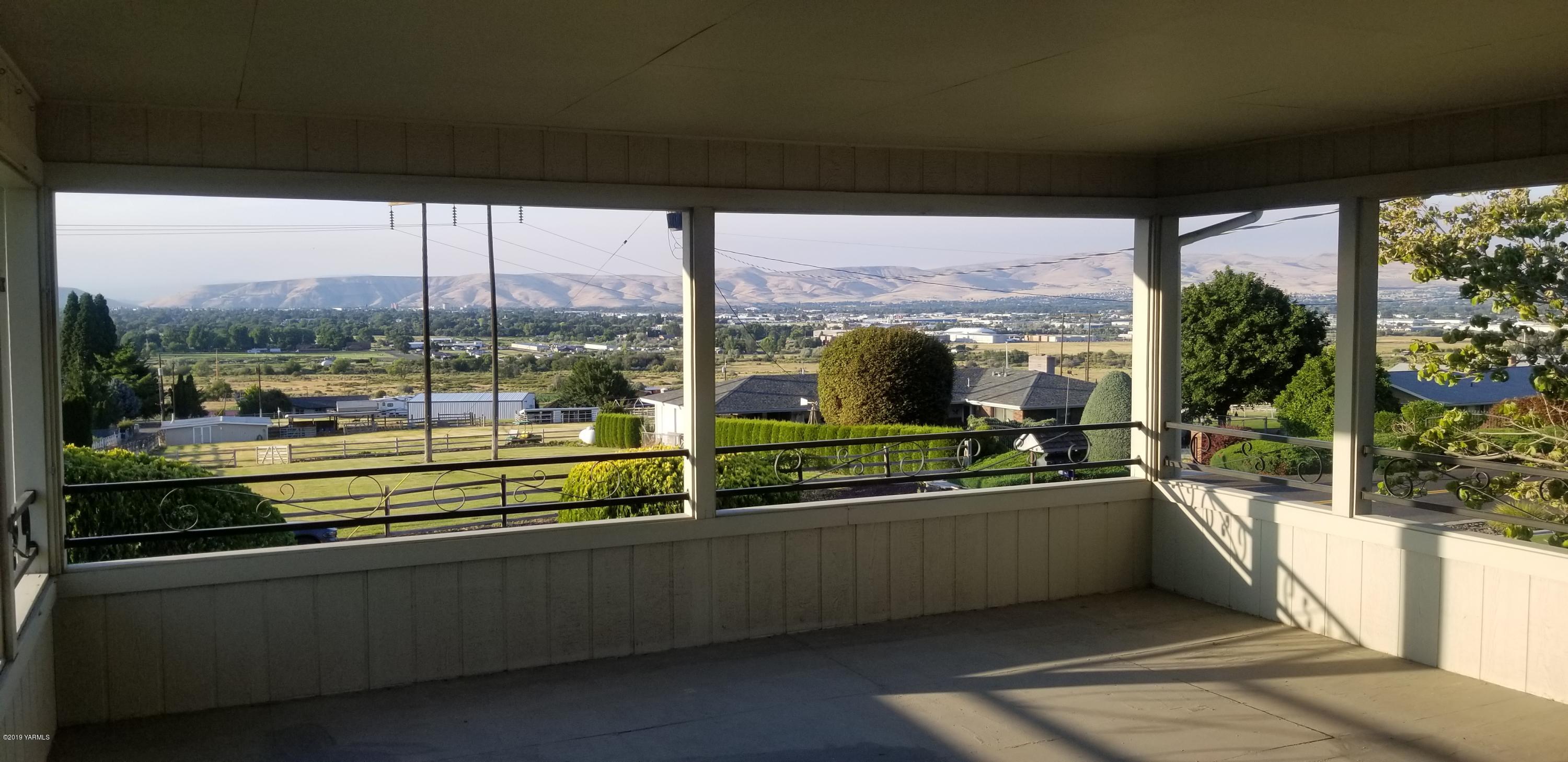 708 Meadowbrook Road Yakima, WA 98903 - Photo 3 of 65 a kitchen with a large window and a sink